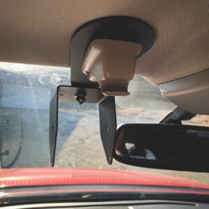 A car mirror with the sun shining on it.