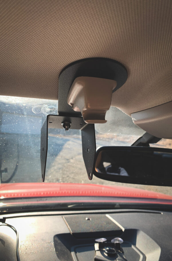 A car mirror with the sun shining on it.