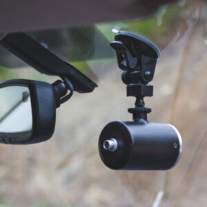A car mirror with the camera on it.