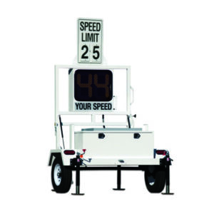 A white trailer with a speed limit sign on it.
