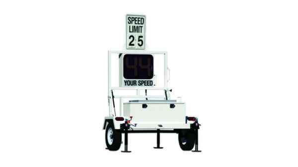 A white trailer with a speed limit sign on it.